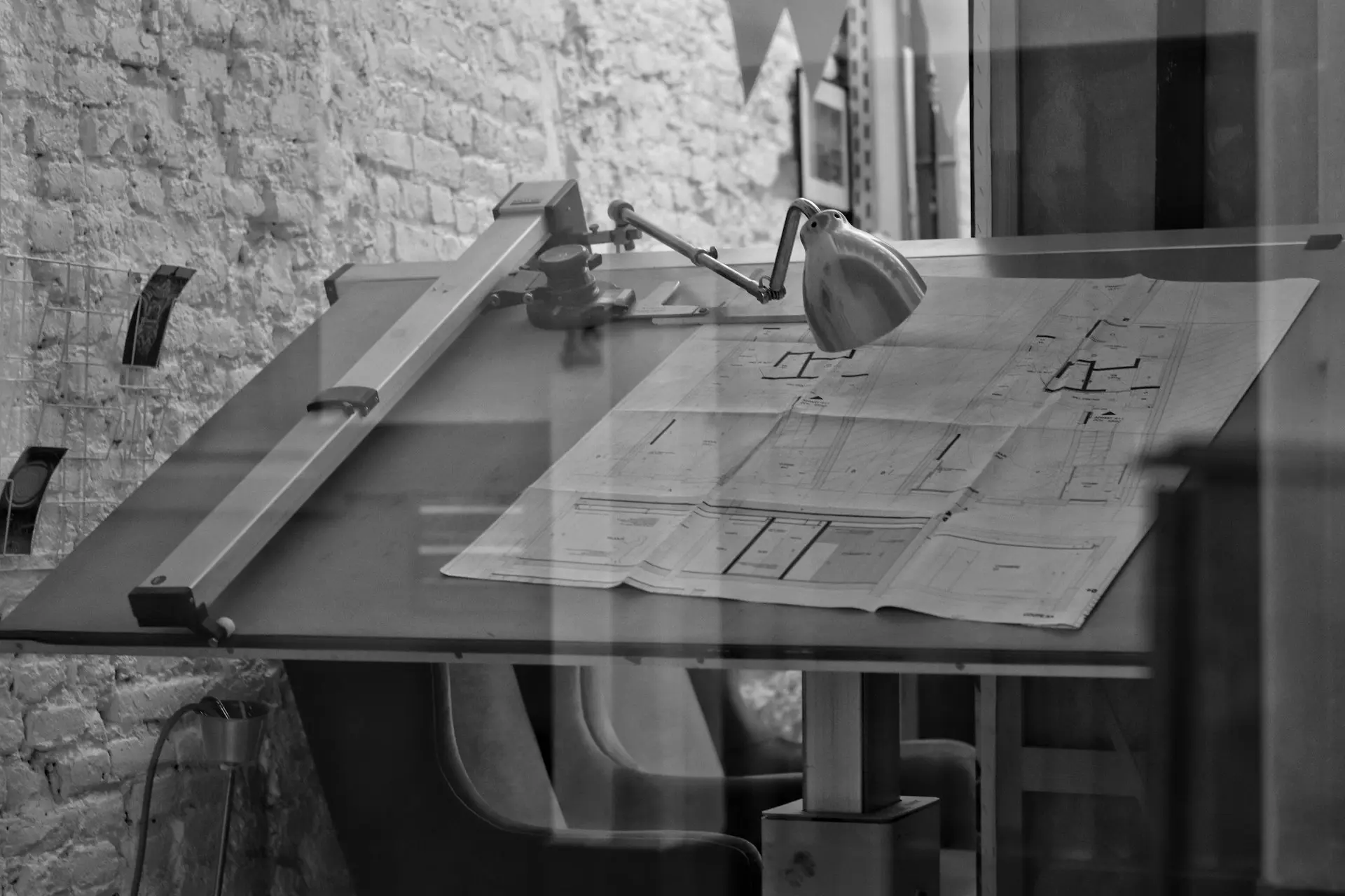 grayscale photo of chair and table